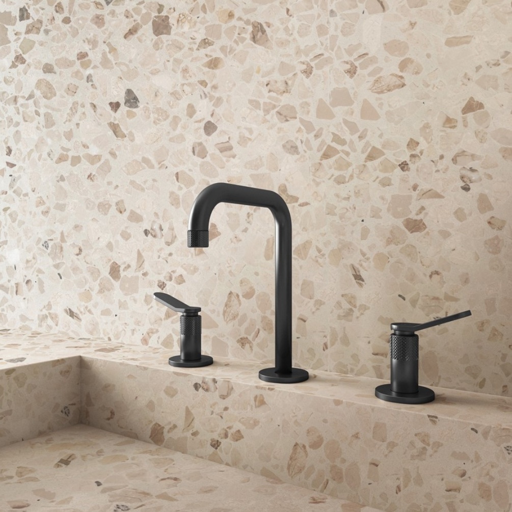 Lifestyle image of the Crosswater Calix Matt Black 3 Tap Hole Deck Mounted Basin Mixer mounted on a basin surface